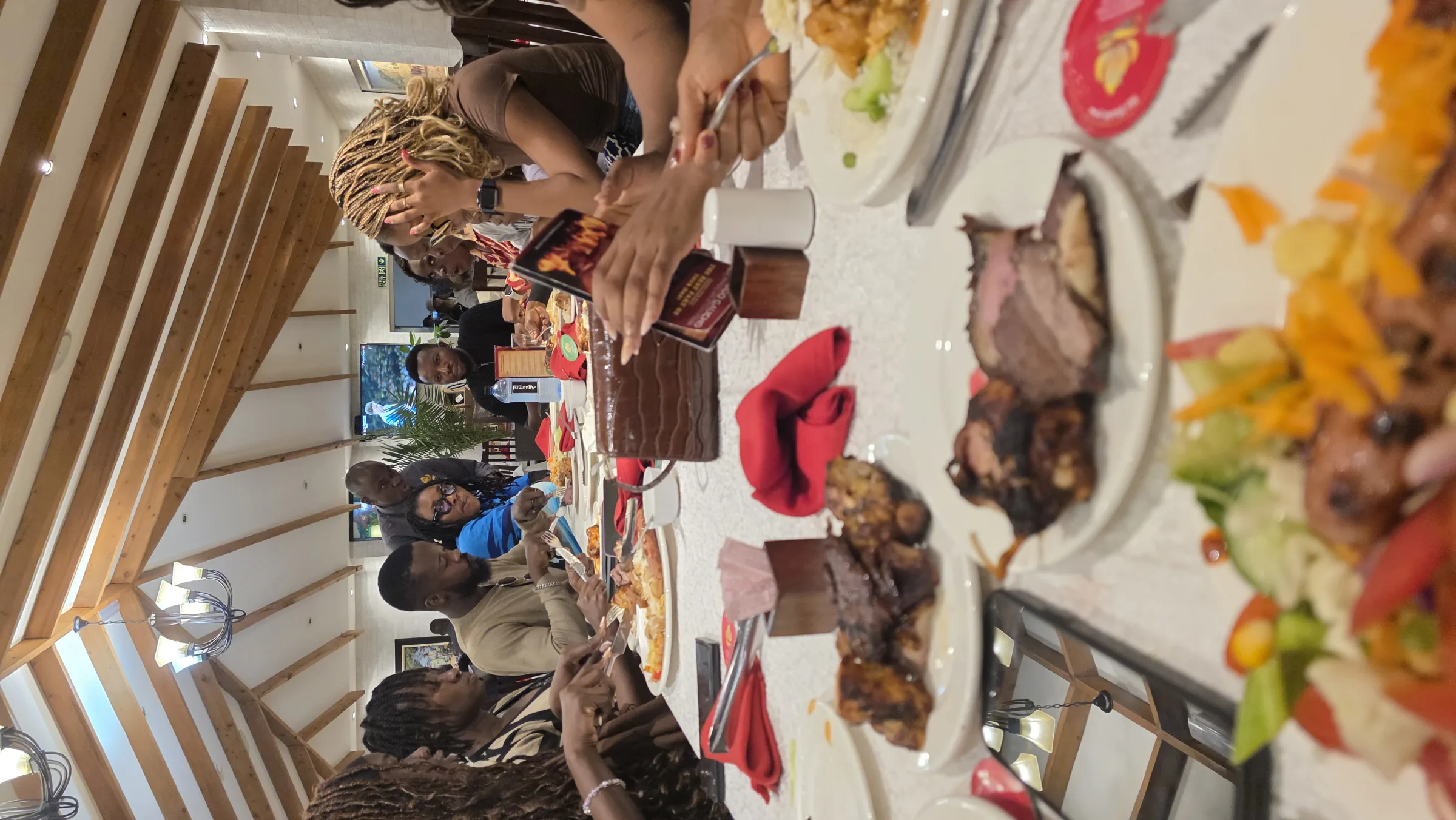 Members around a table spread with food