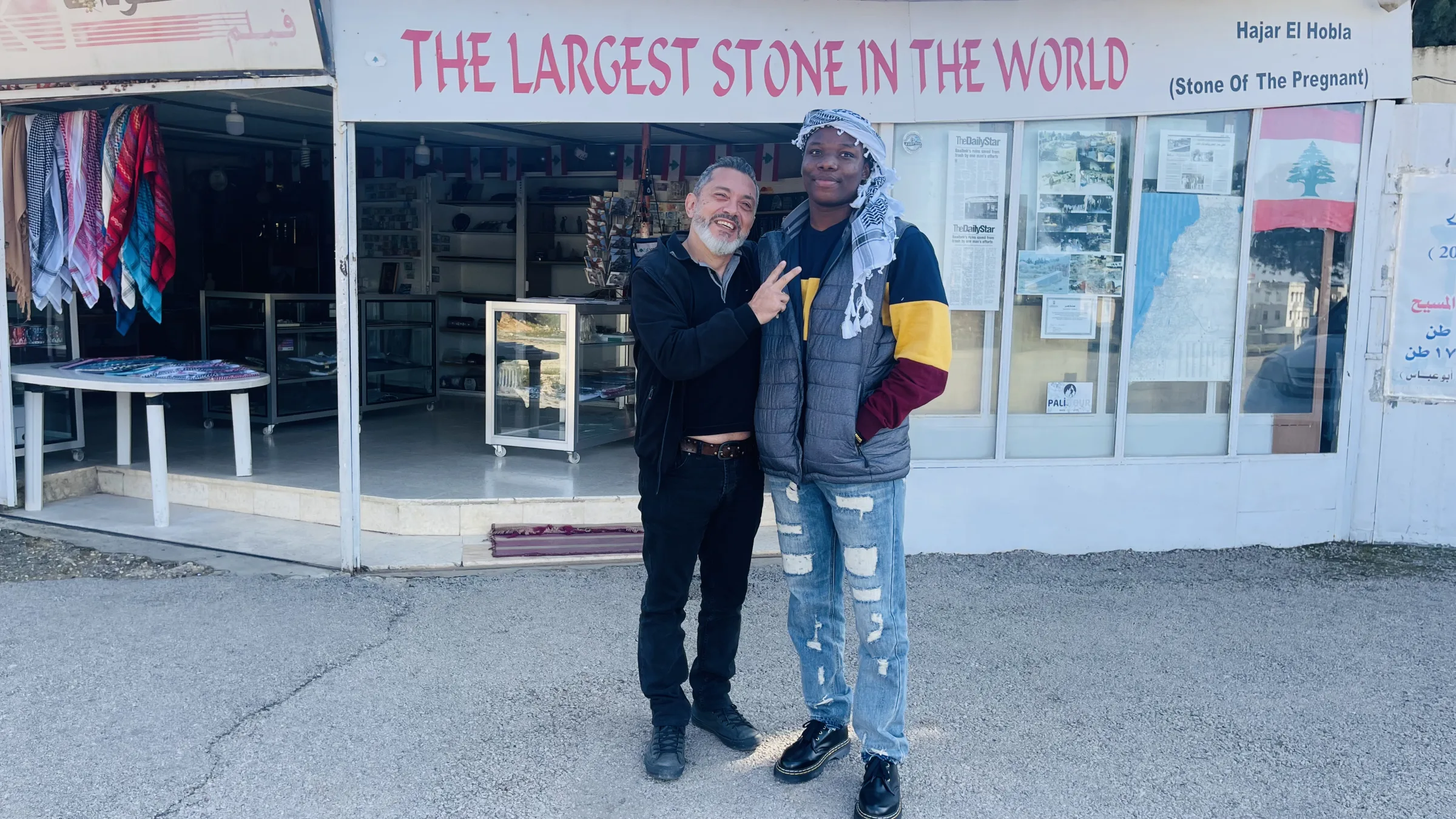 Two members outside the Largest Stone in the World shop
