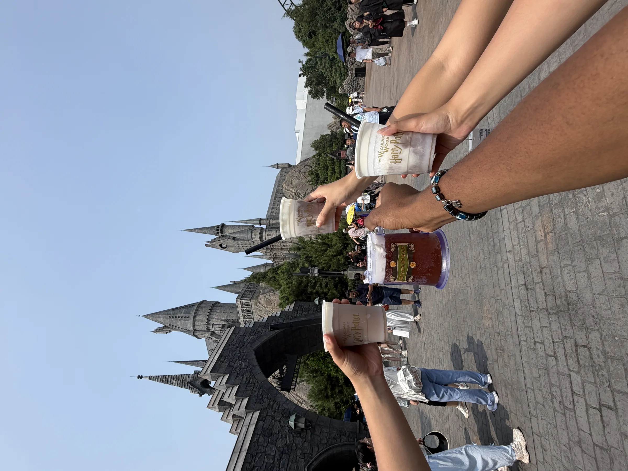 Drinks raised in front of a cathedral